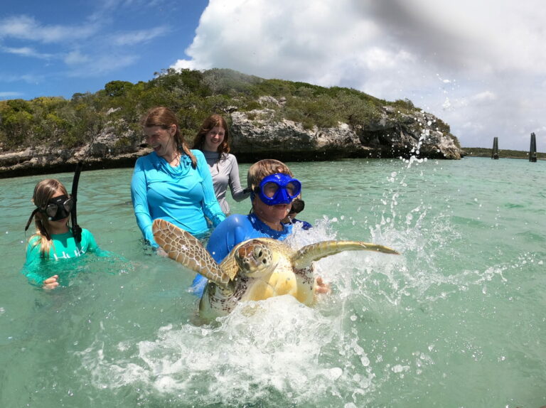 Gabriel holding a sea turtle