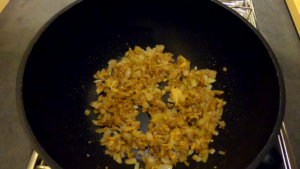 Cooking onions, ginger, garlic, and curry powder