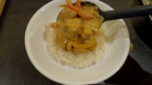 Serving spicy coconut fish curry